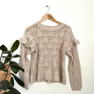 Creamed color, long sleeve sweater with ruffle shoulder detail